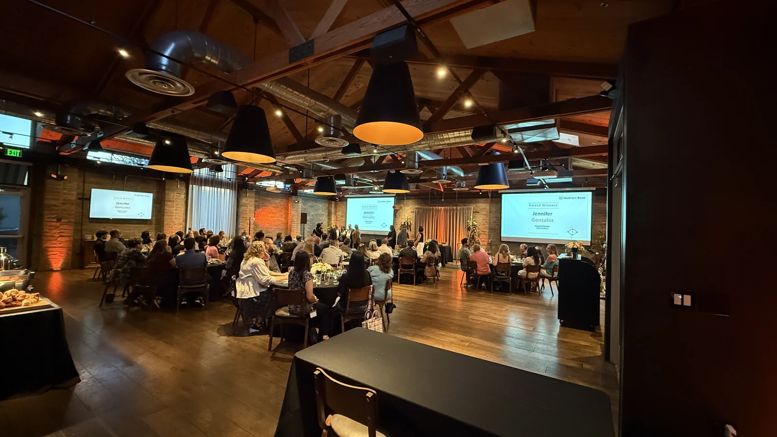 MidFirst Bank All-Star award winner names displayed on presentation screens during an employee recognition event