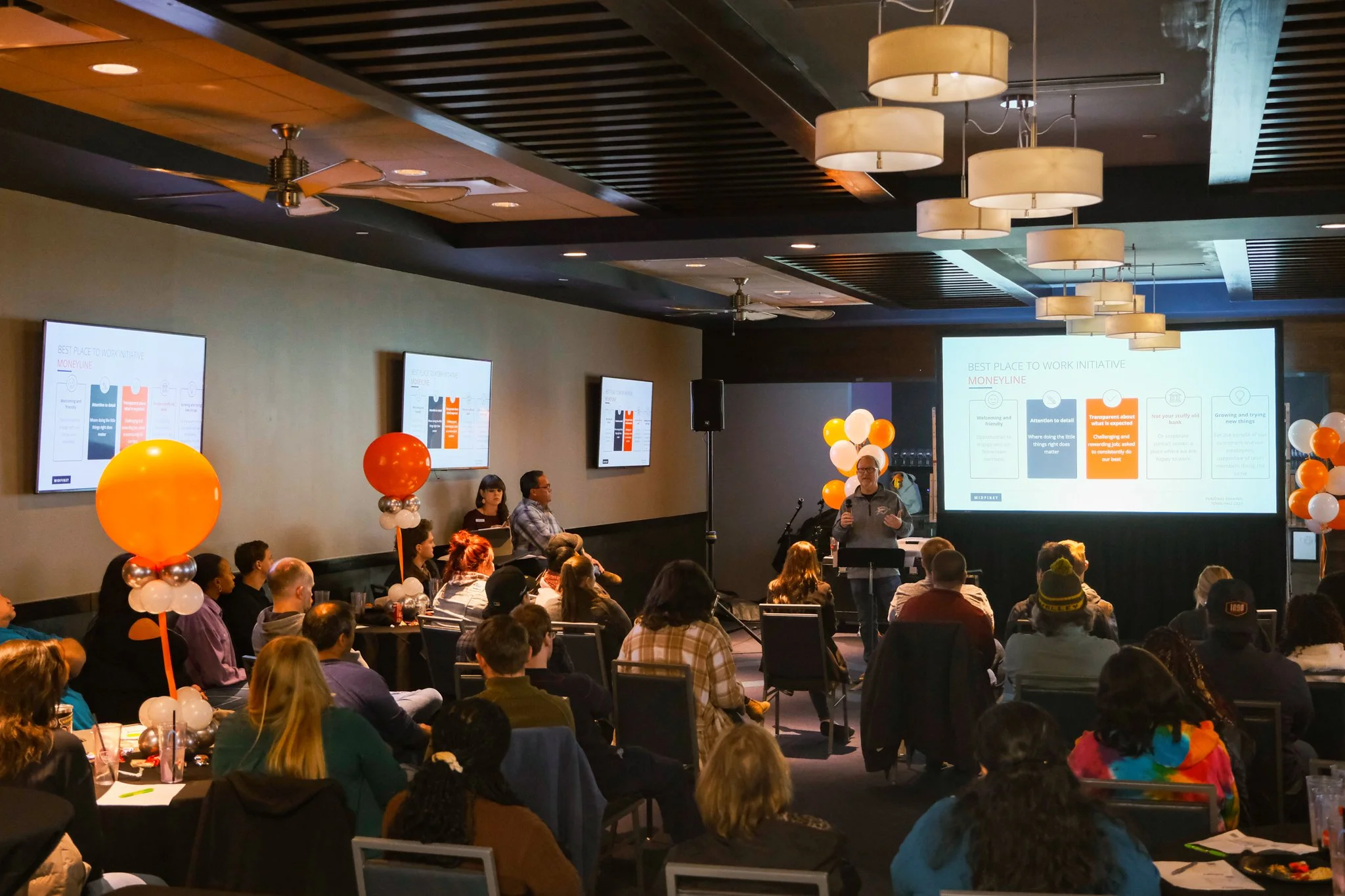 MidFirst Bank executive presenting to employees during a town hall event